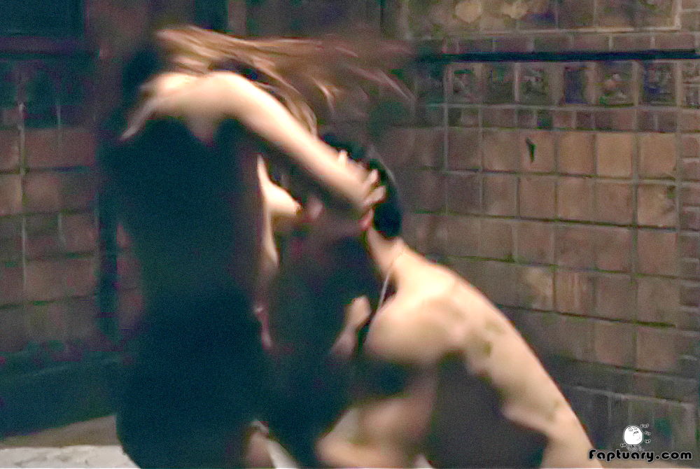 Florence Welch topless as she dances with a guy in a music video